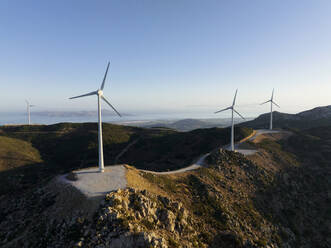 Greece, Aegean, Kos, Wind farm turbines at dawn - CVF02187