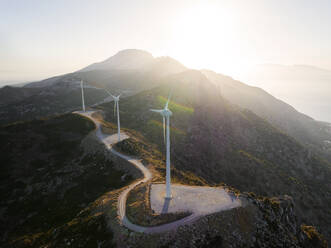 Greece, Aegean, Kos, Wind farm turbines at sunrise - CVF02188
