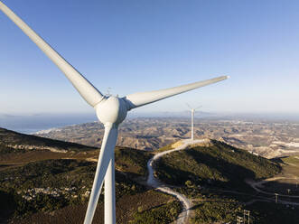 Greece, Aegean, Kos, Wind farm turbines at dawn - CVF02191