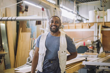 Portrait of happy male carpenter in workshop - MASF32502