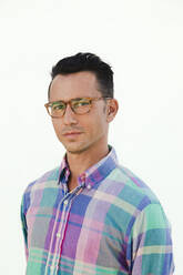 Man wearing eyeglasses against white background - ACTF00272