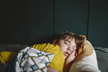 Boy sleeping in bed at home - EYAF02228