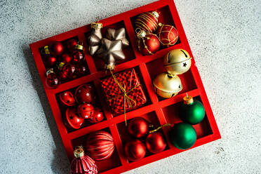 From above red wooden box full of festive decorations for Christmas holiday decor - ADSF39653