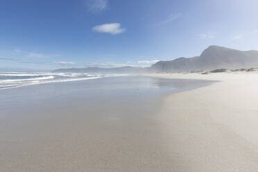 South Africa, Hermanus, Sandy beach with mountains in background on Grotto Beach - TETF01818