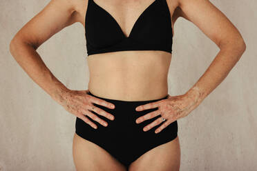 Cropped shot of unrecognizable woman wears top and panties has