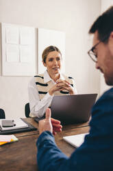 Businesswoman listening to a job applicant's answer during an interview in her office. Female hiring manager having a meeting with a shortlisted candidate. - JLPSF12907