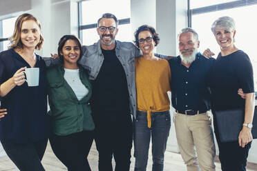 Business team standing together for a group portrait. Group of diverse business people standing together and smiling. - JLPSF13144