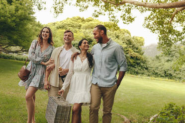 Group of men and woman together going on picnic. Two couple in the park for a picnic. - JLPSF14141