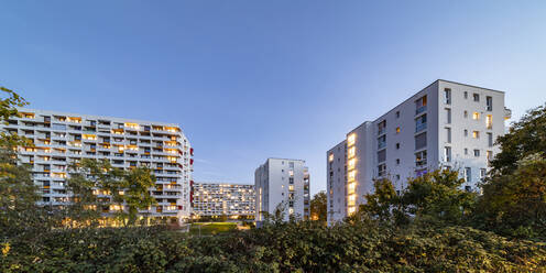 Germany, Baden-Wurttemberg, Stuttgart, Apartment buildings in Hallschlag district at dusk - WDF07086