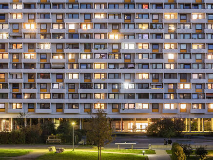 Germany, Baden-Wurttemberg, Stuttgart, Balconies of apartment building in Hallschlag district at dusk - WDF07087