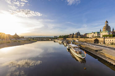 Germany, Saxony, Dresden, Boats moored along Elbe river canal at sunset - WDF07089