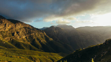 Amazing mountain landscape with dark cloudscape. Beautiful view of Jonkershoek nature reserve. - JLPSF16961