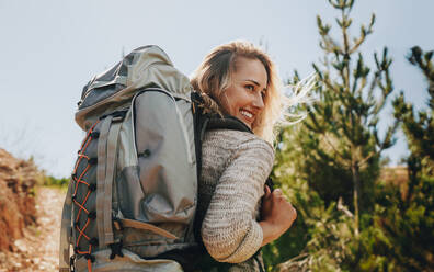 Female hiker standing on a hill