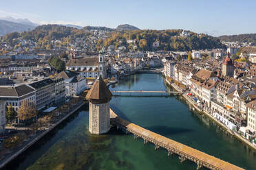 Switzerland, Canton of Lucerne, Lucerne, Aerial view of historic Chapel Bridge in autumn - TAMF03558