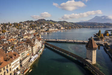 Switzerland, Canton of Lucerne, Lucerne, Aerial view of historic Chapel Bridge in autumn - TAMF03562