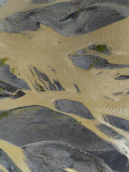 Abstract aerial top down view of sandbanks in glacial river Jokulsa, south Iceland. - AAEF16384