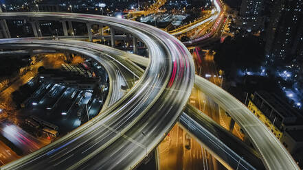 Aerial view of highway intersection in Shanghai at night. - AAEF16433