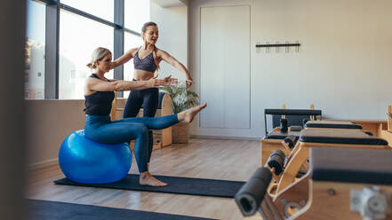 Woman Doing Pilates Arm Work with Straps Stock Image - Image of athlete,  fitness: 153775567