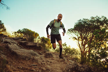 Runner. Running man on cross country trail run marathon in beautiful  landscape nature Stock Photo - Alamy