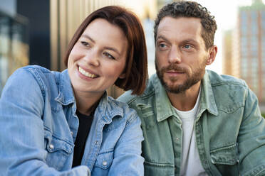 Contemplative couple wearing denim shirts - MOEF04320