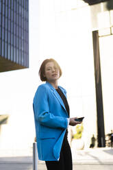 Young businesswoman wearing blue blazer - MOEF04358