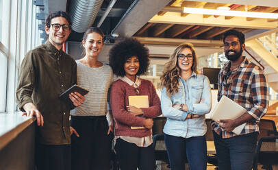 Group photo of five people from a small startup companies. Entrepreneurs doing business. - JLPSF24419