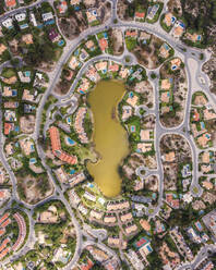 Aerial view of an exclusive luxury village with expensive villas and hotels on Troia Peninsula along the beach with artificial lake, Setubal, Portugal. - AAEF16612