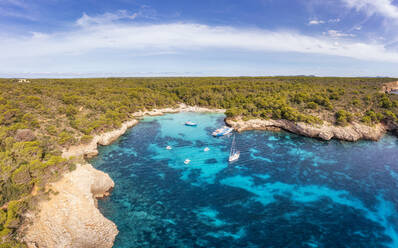 Spain, Balearic Islands, Menorca, Boats in Cala Turqueta bay - SMAF02352