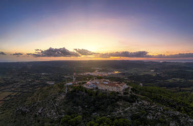 Spain, Balearic Islands, Menorca, Aerial view of Sanctuary of Verge del Toro at sunset - SMAF02392