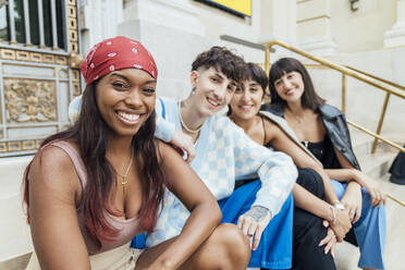 Group portrait of diverse young women wearing clothes in hipster