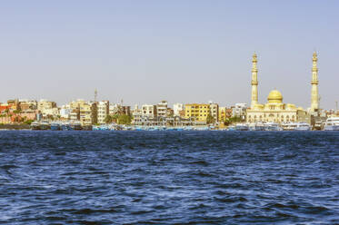 Egypt, Red Sea Governorate, Hurghada, View of coastal city with mosque in background - THAF03134