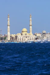 Egypt, Red Sea Governorate, Hurghada, View of coastal city with mosque in background - THAF03136