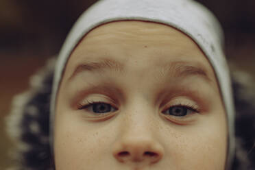 Close-up of girl wearing knit hat - JBUF00125