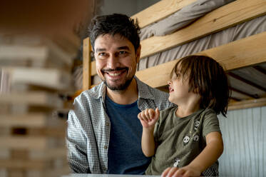 Smiling father with son at home - ANAF00522