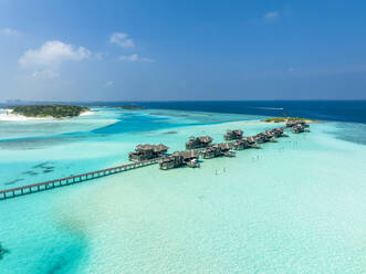 Maldives, Kaafu Atoll, Aerial view of resort bungalows on Lankanfushi island - AMF09652