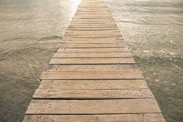 Jetty amidst sea at sunset - JOSEF14826