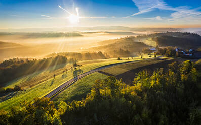 Germany, Baden-Wurttemberg, Drone view of Haselbachtal valley at foggy autumn sunrise - STSF03677