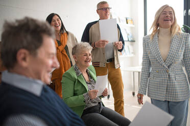 A group of seniors singing together at choir rehearsal. - HPIF00387