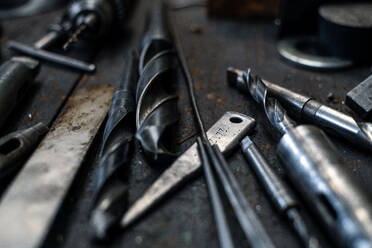 A close up of industrial tools indoors in metal workshop. - HPIF00523