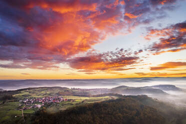 Germany, Baden-Wurttemberg, Drone view of moody sky over Remstal valley at foggy dawn - STSF03690