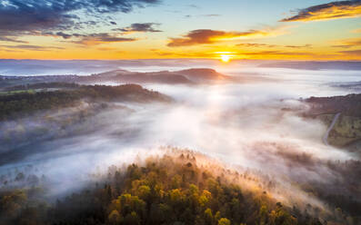 Germany, Baden-Wurttemberg, Drone view of Remstal valley at foggy sunrise - STSF03692