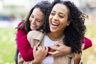 Happy women having fun in park - WPEF06735