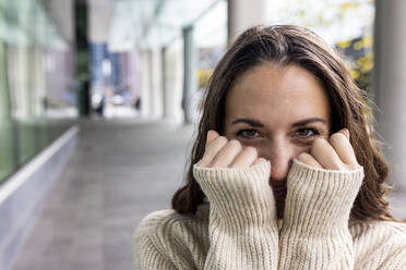 Woman with covering face with hands - WPEF06771