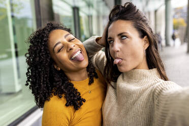 Women talking selfie and making faces - WPEF06787
