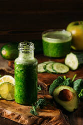 Delicious veggie green detox smoothie on glass bottle - ADSF40771