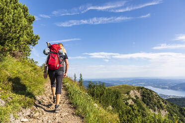 Germany, Bavaria, Female hiker on way to summit of Hirschberg mountain - FOF13215
