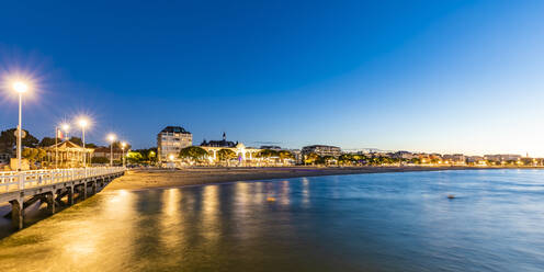 France, Nouvelle-Aquitaine, Arcachon, Panoramic view of Arcachon Bay and surrounding town at dusk - WDF07154