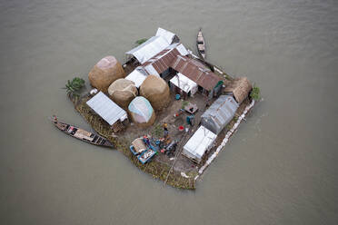 Aerial view of people working on a floating platform for fishing