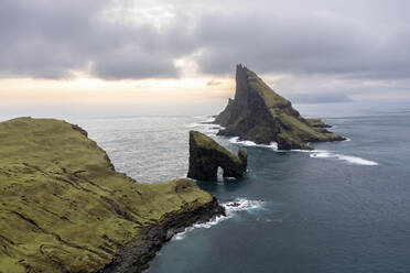 Drangarnir rock in the sea under cloudy sky - WPEF06826