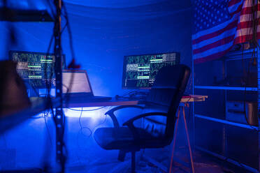 An internet hacker workplace in dark office, cyberwar concept. - HPIF00975
